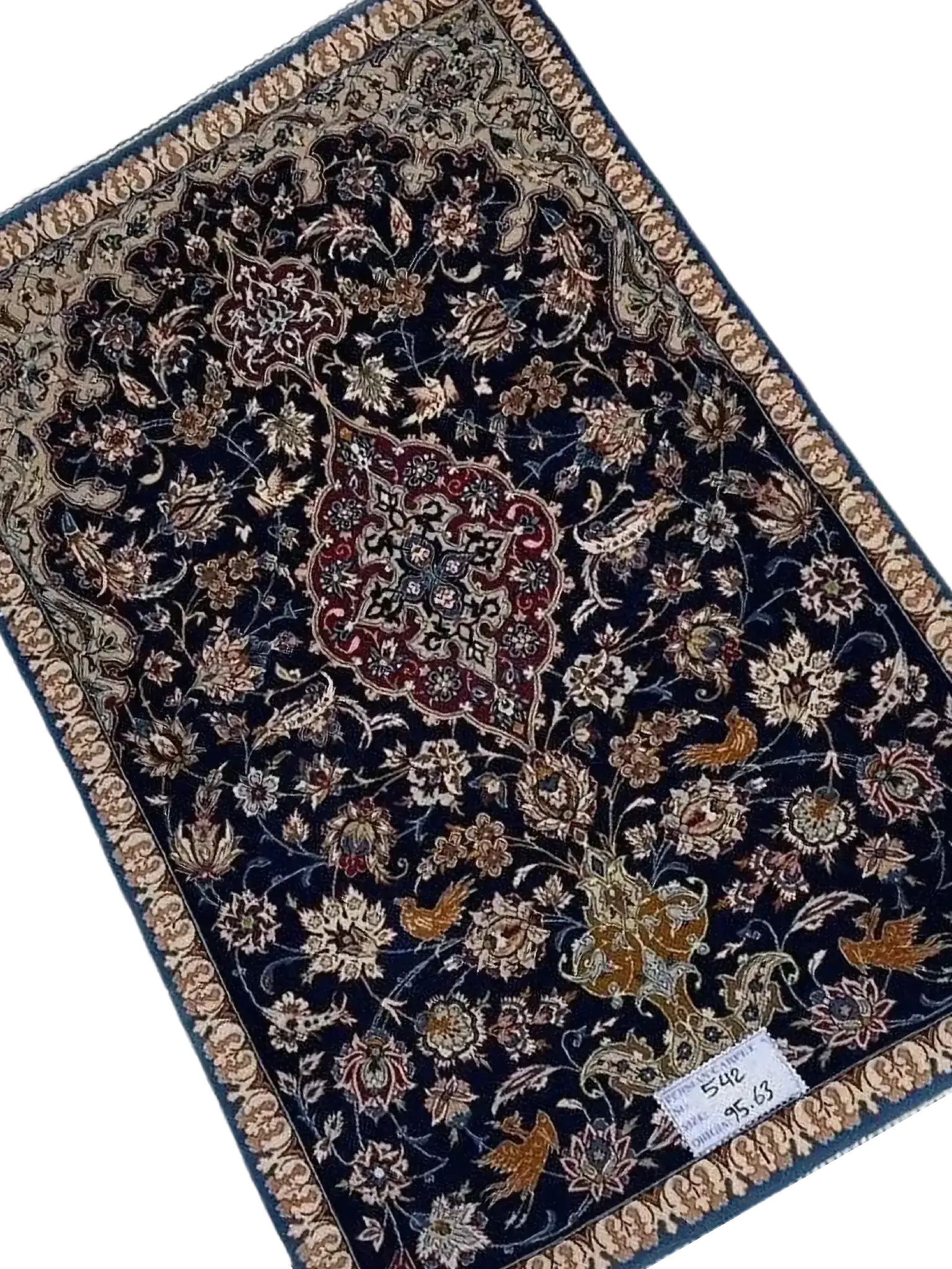 "Antique Persian carpet from Isfahan, Iran, handcrafted with wool and silk. The rug measures 95 cm x 63 cm (3.1 x 2.1 feet) and has a knot density of 1,000,000 knots per square meter. A 70-year-old vintage piece with intricate detailing."